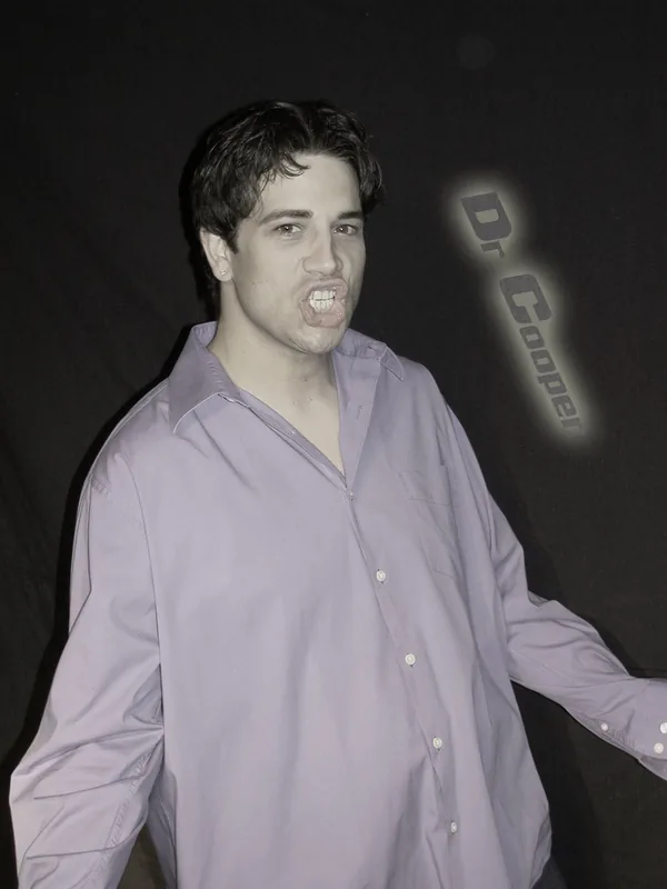 A younger Tony Costello in a lavender shirt, around 2003
